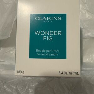 Clarins Wonder Fig Scented Candle in White and Teal